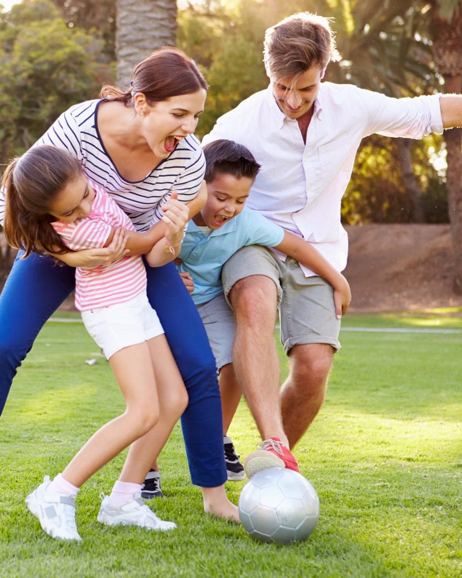A family playing together outdoors