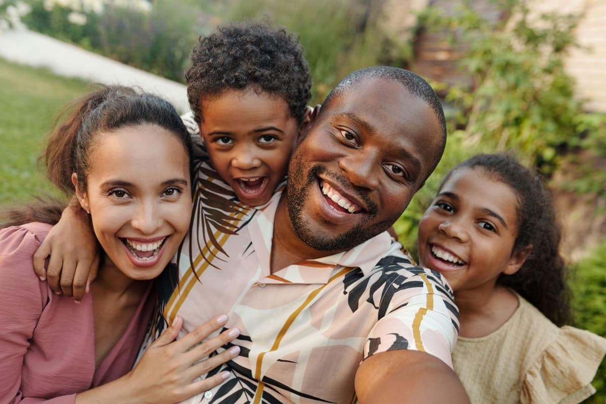 A family taking a selfie in the garden
